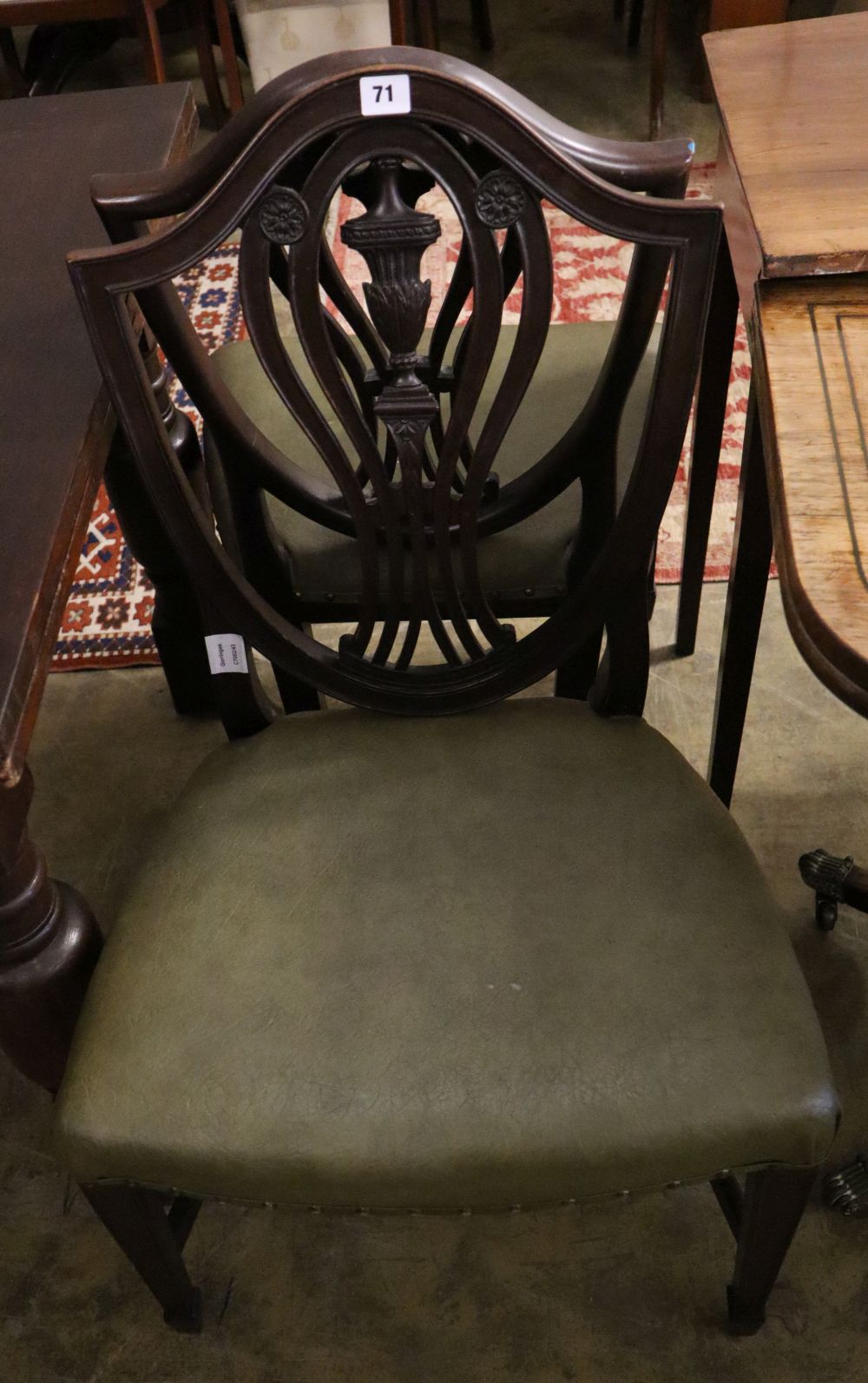 A pair of Victorian Hepplewhite style chairs with leather seats